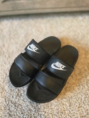 Nike Black Slides with White Swoosh Logo